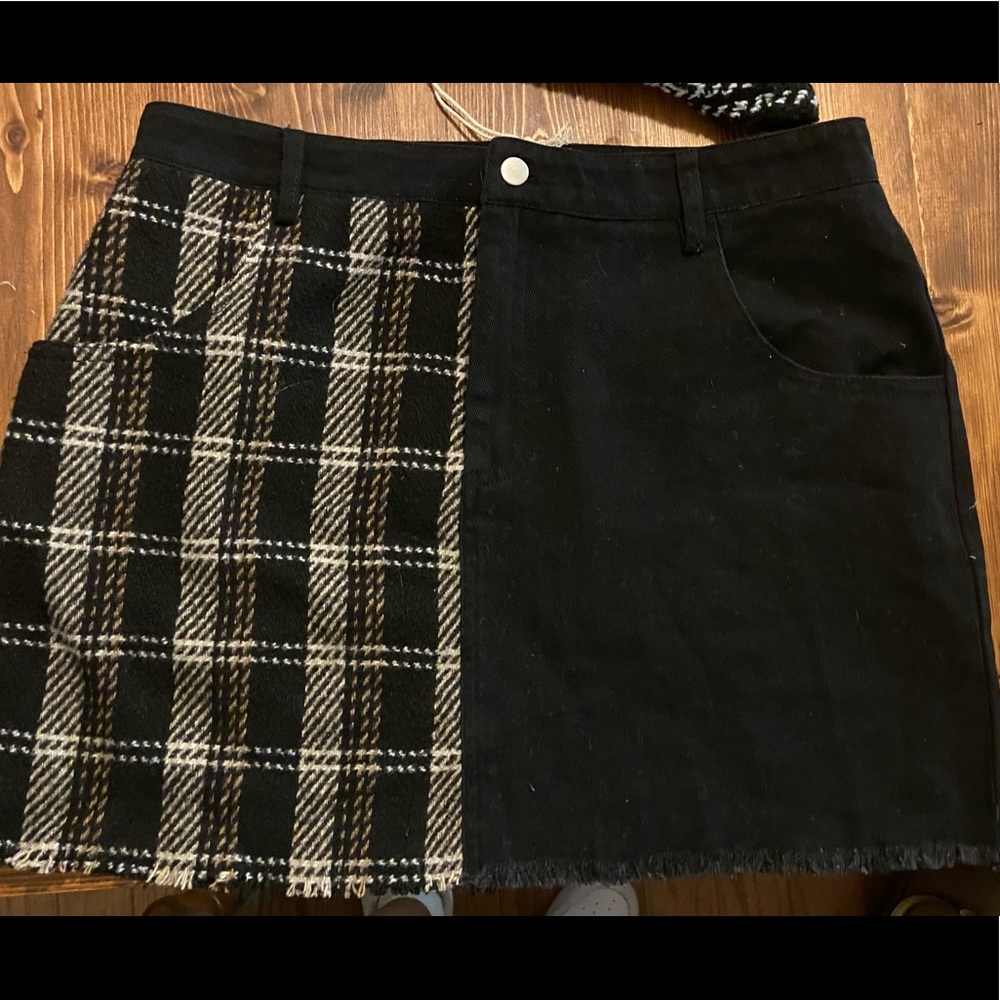 Short, half-black half-plaid skirt